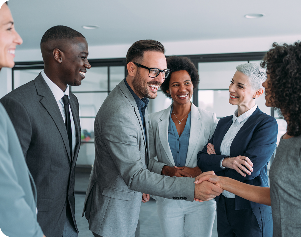 A group of people greeting each other.